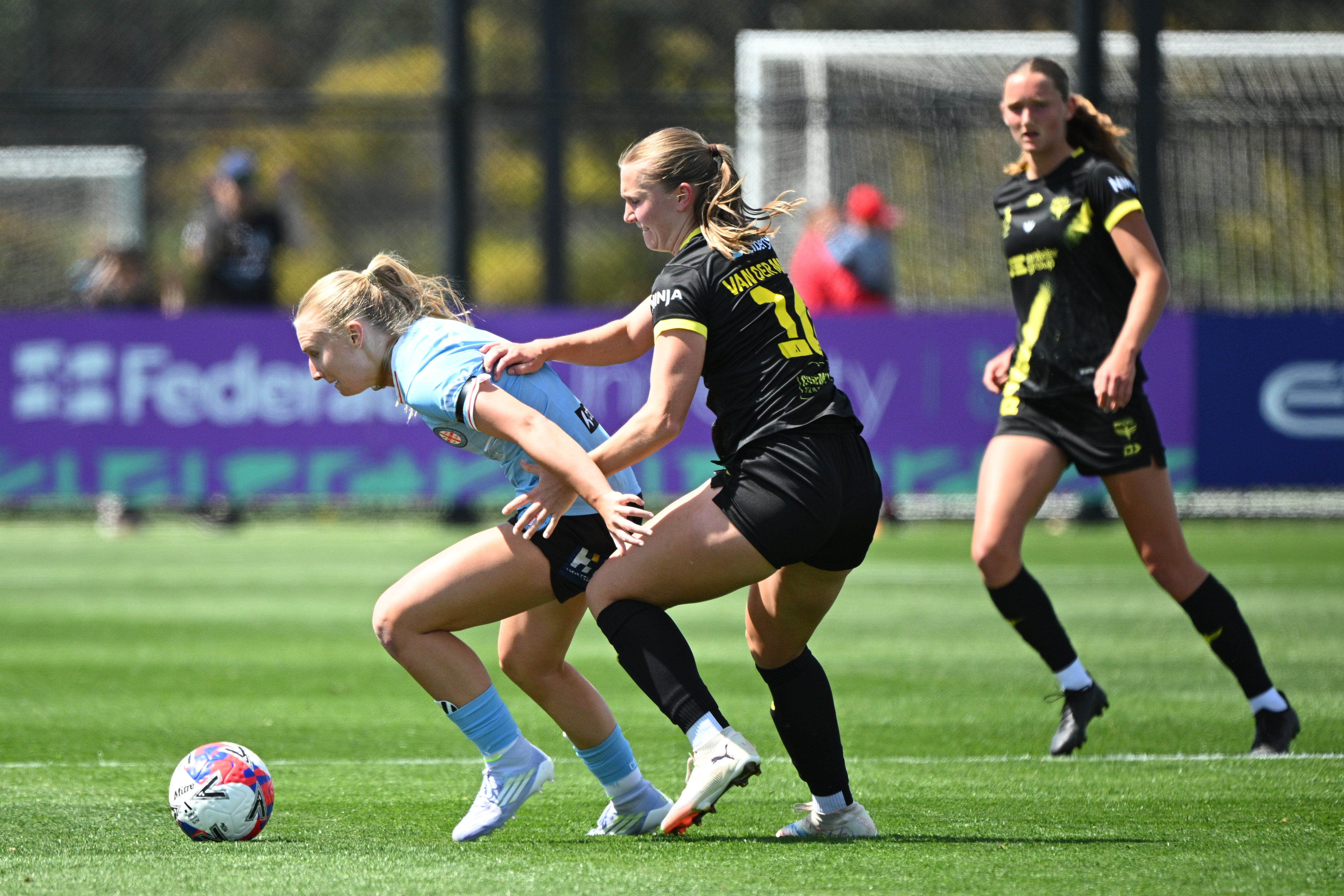 Holly McNamara of Melbourne City and Marisa Van Der Meer of Wellington Phoenix contest the ball during the round six A-League Women match between Melbourne City and Wellington Phoenix at ctrl:cyber Pitch, on December 07, 2025, in Melbourne, Australia. (Photo by Vince Caligiuri/Getty Images)