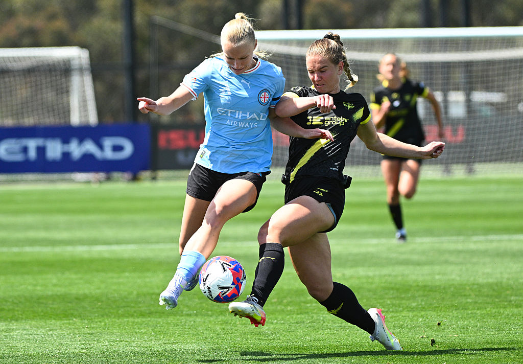 MELBOURNE, AUSTRALIA - DECEMBER 07: Holly McNamara of Melbourne City and Lara Wall of Wellington Phoenix contest the ball during the round six A-League Women match between Melbourne City and Wellington Phoenix at ctrl:cyber Pitch, on December 07, 2025, in Melbourne, Australia. (Photo by Vince Caligiuri/Getty Images)