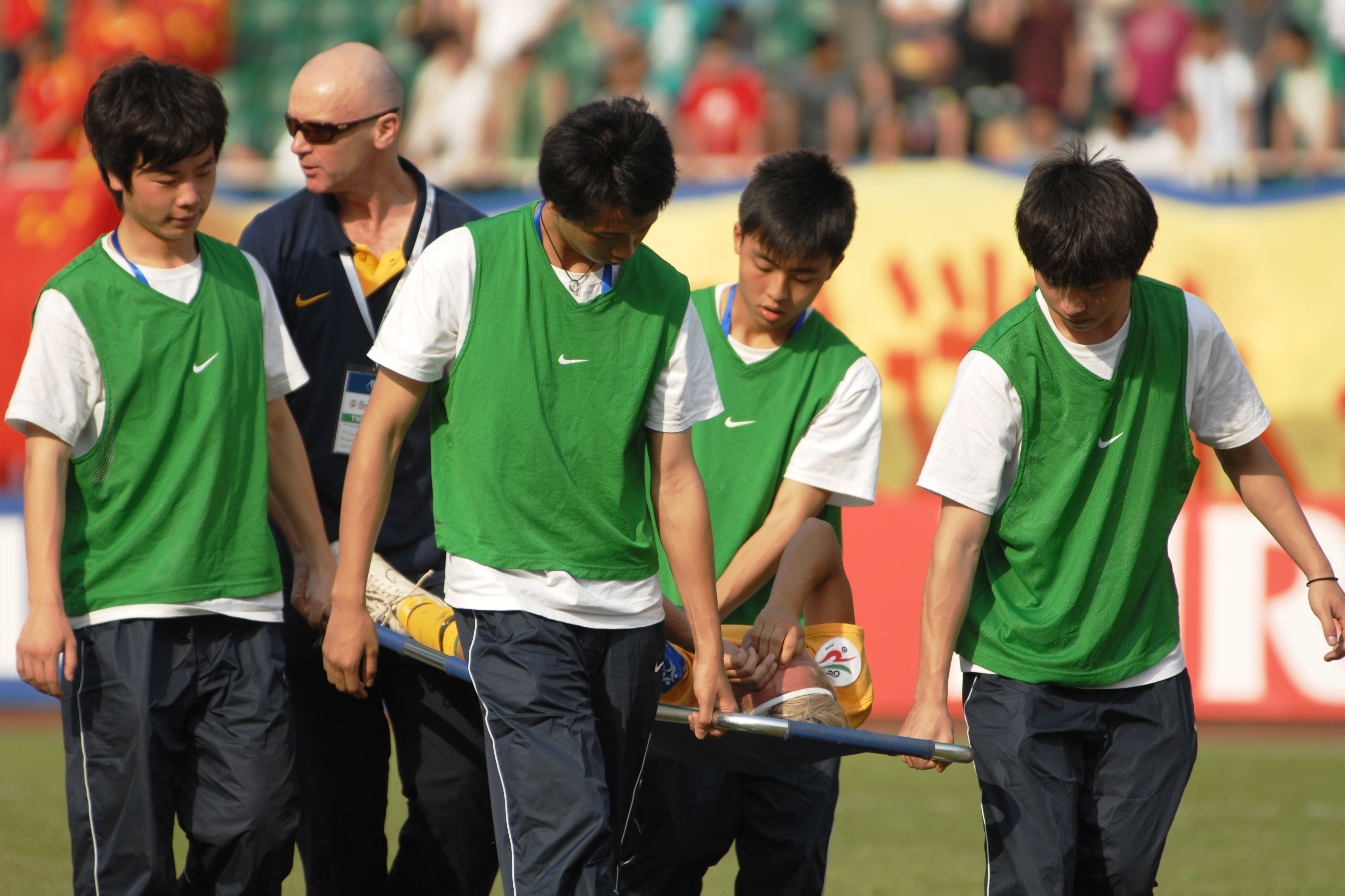 Lisa de Vanna stretchered off the field against Vietnam (Photo: Paul Lau)