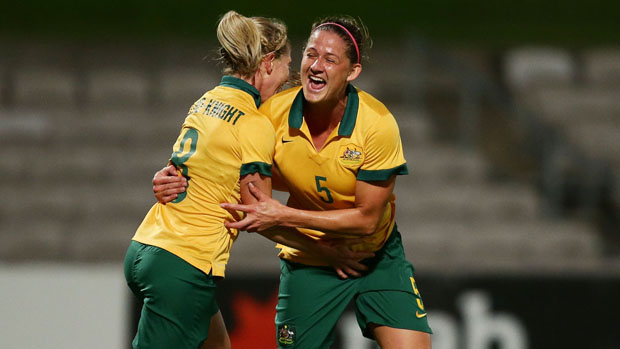 Laura Alleway celebrates a goal with Elise Kellond-Knight.