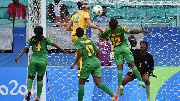 Alanna Kennedy heads home a goal against Zimbabwe at the Games.