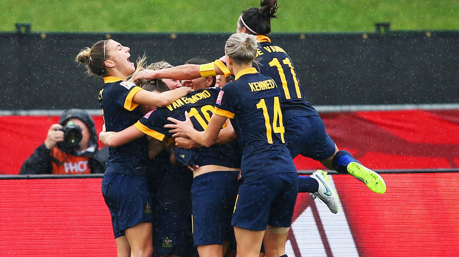 Matildas players celebrate Kyah Simon's goal against Brazil.