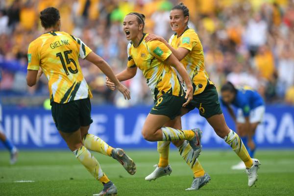 Caitlin Foord celebrates her goal as Chloe Logarzo and Emily Gielnik converge