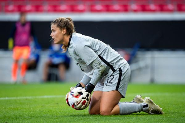 Teagan Micah collects the ball in her debut game v Sweden 