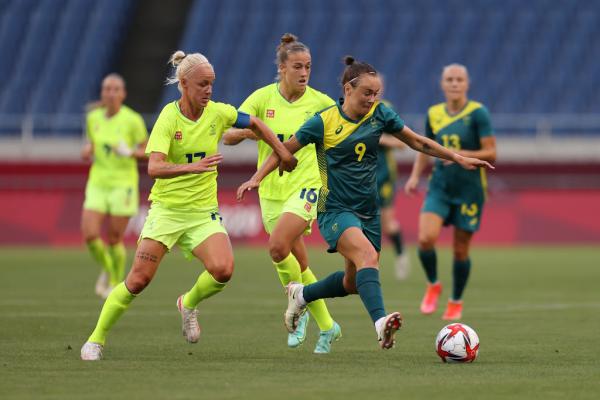 SAITAMA, JAPAN - JULY 24: Caitlin Foord #9 of Team Australia battles for possession with Caroline Seger #17 of Team Sweden during the Women's First Round Group G match between Sweden and Australia on day one of the Tokyo 2020 Olympic Games at Saitama Stadium on July 24, 2021 in Saitama, Japan. (Photo by Francois Nel/Getty Images)