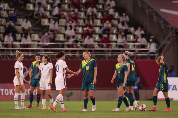 Australian and American players shake hands after their draw at the Olympics 