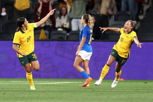 Sam Kerr and Kyah Simon celebrate a goal against Brazil 