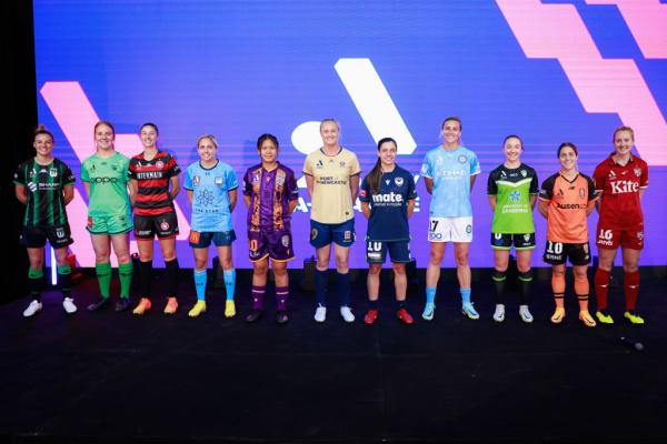 SYDNEY, AUSTRALIA - NOVEMBER 16: Dylan Holmes, Adelaide United, Katrina Gorry, Brisbane Roar, Laura Hughes, Canberra United, Hannah Wilkinson, Melbourne City, Alex Chidiac, Melbourne Victory, Tara Andrews, Newcastle Jets, Susan Phonsongkham, Perth Glory, Mackenzie Hawkesby, Sydney FC Amy Harrison, Western Sydney Wanderers, Lily Alfield, Wellington Phoenix, Chloe Logarzo, Western United FC pose for a group photo during the A-League Women's 2022-23 Season Launch at Ultra Football on November 16, 2022 in Sydne