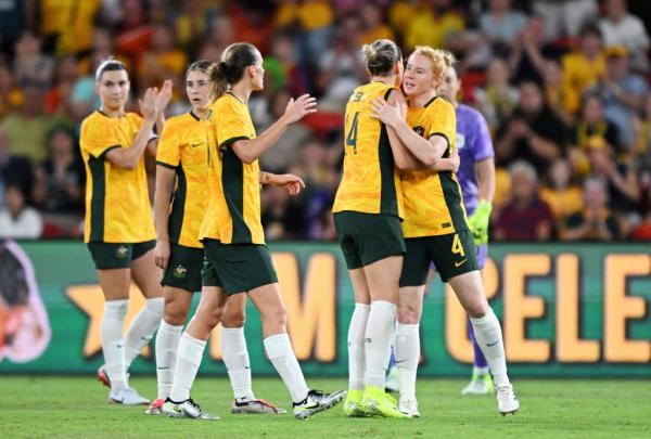 BRISBANE, AUSTRALIA - NOVEMBER 28: Clare Polkinghorne of Australia embraces teammate Alanna Kennedy as she is subbed off during her final appearance for Australia in the International Friendly match between the Matildas and Brazil at Suncorp Stadium on November 28, 2024 in Brisbane, Australia. (Photo by Bradley Kanaris/Getty Images)