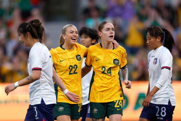 MELBOURNE, AUSTRALIA - DECEMBER 04: Sharn Freier of Australia celebrates with team mates after scoring a goalduring the International Friendly match between Australia Matildas and Chinese Taipei at AAMI Park on December 04, 2024 in Melbourne, Australia. (Photo by Daniel Pockett/Getty Images)