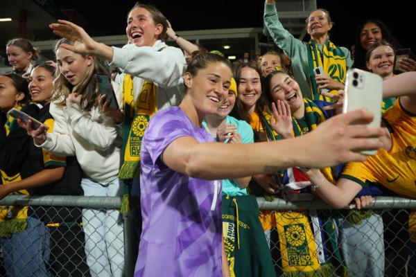 Teagan Micah of the Matildas takes a selfie with the fans after during the AFC Women's Asian Olympic Qualifier match between Australia Matildas and IR Iran at HBF Park on October 26, 2023 in Perth, Australia. (Photo by James Worsfold/Getty Images)