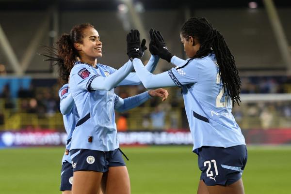 MANCHESTER, ENGLAND - FEBRUARY 16: Khadija Shaw of Manchester City celebrates scoring her team's first goal with teammate Mary Fowler during the Barclays Women's Super League match between Manchester City FC and Liverpool FC at Joie Stadium on February 16, 2025 in Manchester, England. (Photo by Matt McNulty/Getty Images)