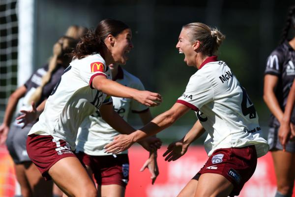 WELLINGTON, NEW ZEALAND - MARCH 02: Ella Tonkin of Adelaide United celebrates with Matilda McNamara after scoring a goal during the round 17 A-League Women's match between Wellington Phoenix and Adelaide United at Porirua Park, on March 02, 2025, in Wellington, New Zealand. (Photo by Hagen Hopkins/Getty Images)