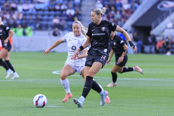 May 24, 2025, Los Angeles, California, USA: Alanna Kennedy 14 of the Angel City FC passes the ball as Katie OÃ¢â‚¬â ¢Kane 20 of the Racing Louisville FC defends during their regular season NWSL game on Saturday May 24, 2025 at the BMO Stadium in Los Angeles, California