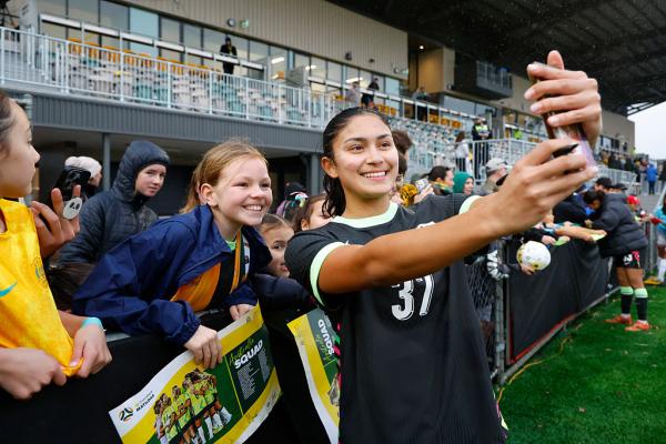 BUNBURY, AUSTRALIA - JULY 05: Alexia Apostolakis of the Matildas takes a selfie with the fans after the match during the International Friendly match between Australia Matildas and Panama at Hands Oval on July 05, 2025 in Bunbury, Australia. (Photo by James Worsfold/Getty Images)