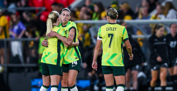 ADELAIDE, AUSTRALIA - DECEMBER 02: Kaitlyn Torpey and Alanna Kennedy of the Matildas celebrate the final whistle with Steph Catley of the Matildas during the International Friendly match between Australia Matildas and New Zealand Football Ferns at Coopers Stadium on December 02, 2025 in Adelaide, Australia. (Photo by Mark Brake/Getty Images)