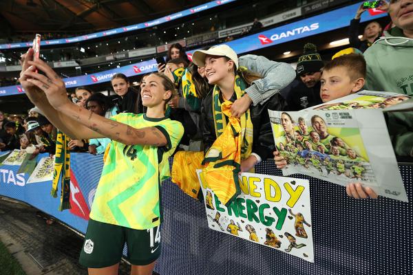 : Alanna Kennedy of Australia poses for a selfie with fans after winning the International Friendly match between Australia Matildas and Argentina at Marvel Stadium on May 30, 2025 in Melbourne, Australia. (Photo by Robert Cianflone/Getty Images)