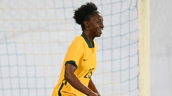 Princess Ibini-Isei reacts to her first senior goal for Australia