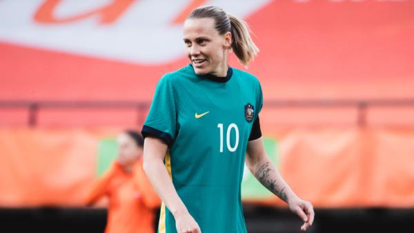 Family and teammates congratulate Emily van Egmond on 100 caps 