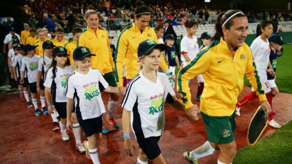Lisa De Vanna leads the Westfield Matildas out against Vietnam in their farewell match.