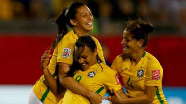 Brazil's Raquel celebrates her winner against Costa Rica with teammates.