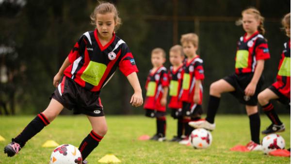 Young girls and boys get involved in FFA's Play Football initiative.