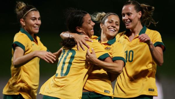 Matildas players celebrate a goal in their demolition of Vietnam.