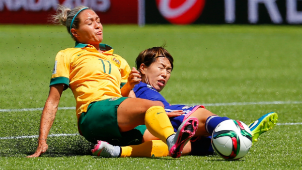 Kyah Simon has a shot blocked by Japan's Azusa Iwashimizu.