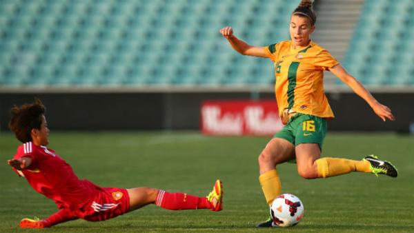 Defender Steph Catley puts a cross in against China.