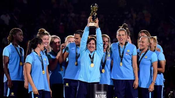 Lisa De Vanna holds the Tournament of Nations trophy aloft.