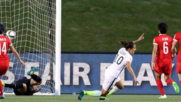 Carli Lloyd celebrates scoring for the USA against China.