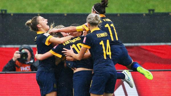 The Matildas celebrate becoming the first Aussie team to win a knock-out match at a World Cup.