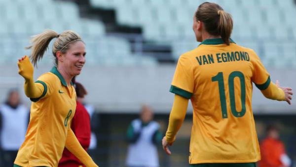 Westfield Matildas Elise Kellond-Knight and Emily van Egmond celebrate a goal in Rio Games qualification.