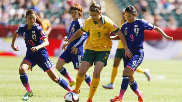 Larissa Crummer tries to weave her way past Japan's defence at the Women's World Cup.