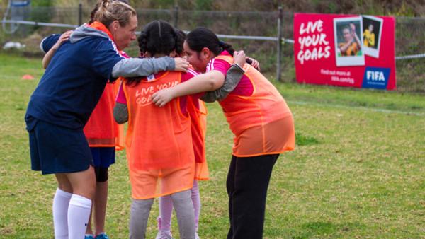 Leah Blayney giving guidance to some of her young players.