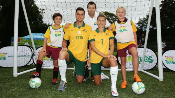 Tomi Juric, Steph Catley and Brett Emerton with kids at the AIA Vitality MiniRoos launch.