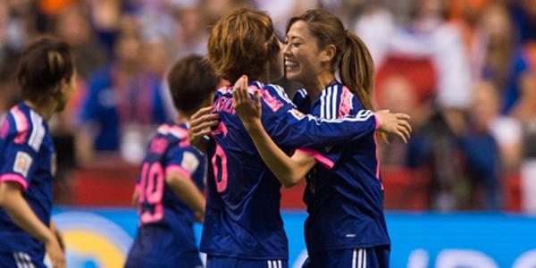 Japanese players celebrate a goal in their 2-1 win over the Netherlands.