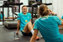 Amy Sayer smiling in the gym in Dubai - Tiffany Williams
