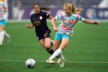 San Diego Wave FC defender Kaitlyn Torpey (16) passes the ball in front of Seattle Reign FC forward Emeri Adames (47) during the first half at Lumen Field.