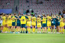 Australia's team players celebrate winning the women's group B football match between Australia and Zambia during the Paris 2024 Olympic Games at the Nice Stadium in Nice on July 28, 2024. (Photo by Valery HACHE / AFP) (Photo by VALERY HACHE/AFP via Getty Images)