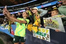 : Alanna Kennedy of Australia poses for a selfie with fans after winning the International Friendly match between Australia Matildas and Argentina at Marvel Stadium on May 30, 2025 in Melbourne, Australia. (Photo by Robert Cianflone/Getty Images)